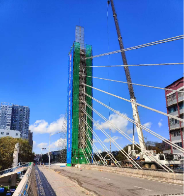 Yuantong Bridge cable replacement construction site with stay cables and crane